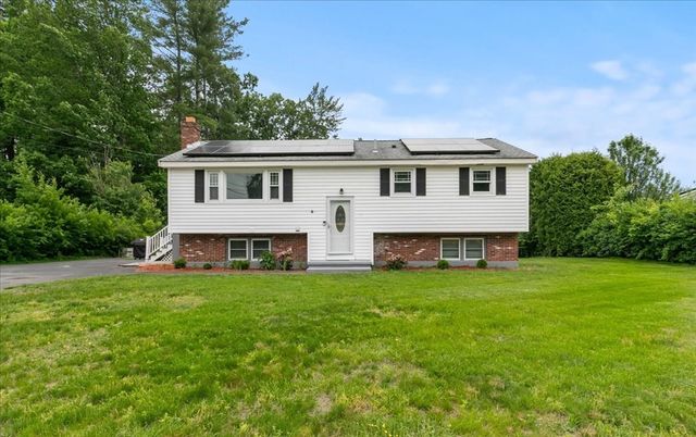 Backyard, Exterior, Facade, Brick Facade, Solar Panels, Raised Ranch