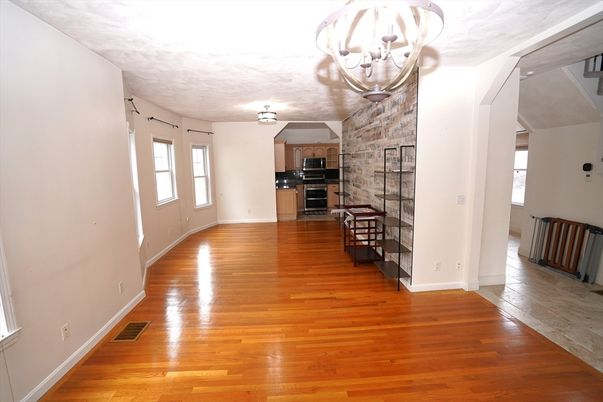 Chandelier, Empty room, Interior, Kitchen, Stainless Steel Appliances, Stone Walls, Wood Texture Flooring