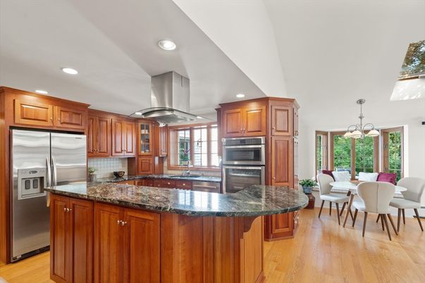 Chandelier, Dining room, Interior, Kitchen, Pendant Lights, Recessed Lighting, Stainless Steel Appliances, Wood Texture Flooring