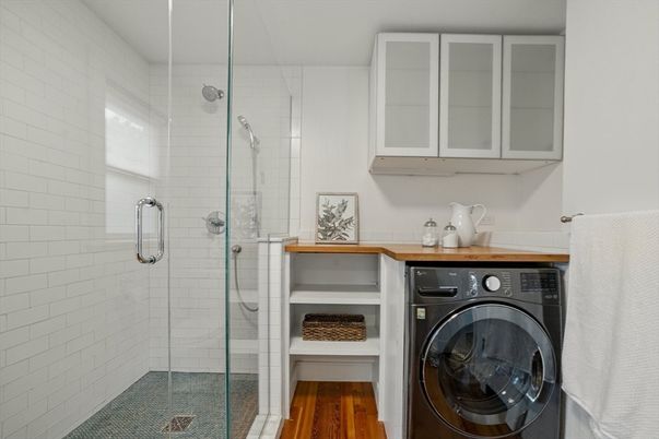 Bathroom, Glass Shower, Interior, Washer, Wood Texture Flooring