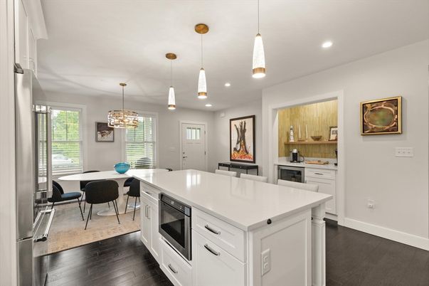 Chandelier, Dining room, Interior, Kitchen, Pendant Lights, Recessed Lighting, Stainless Steel Appliances, Wood Texture Flooring