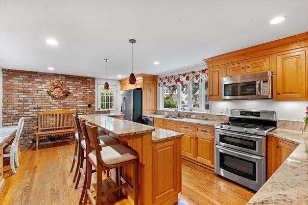 Interior, Kitchen, Pendant Lights, Recessed Lighting, Stainless Steel Appliances, Stone Walls, Wood Texture Flooring
