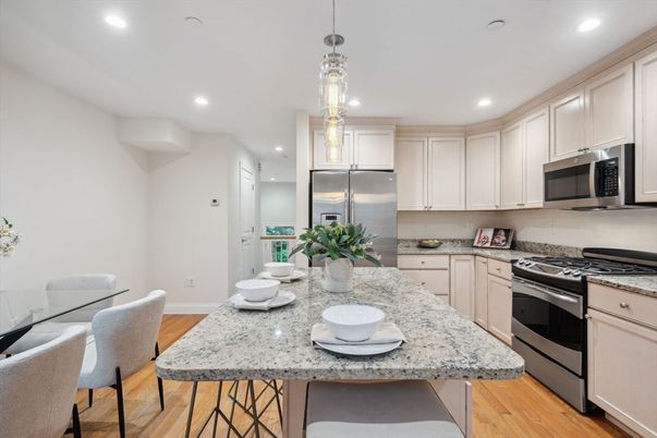 Dining room, Interior, Kitchen, Pendant Lights, Recessed Lighting, Stainless Steel Appliances, Wood Texture Flooring