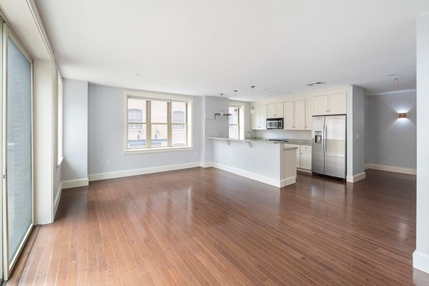 Empty room, Interior, Kitchen, Pendant Lights, Stainless Steel Appliances, Wood Texture Flooring