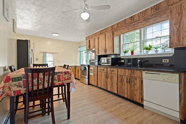 Dining room, Interior, Kitchen, Recessed Lighting, Stainless Steel Appliances, Wood Texture Flooring