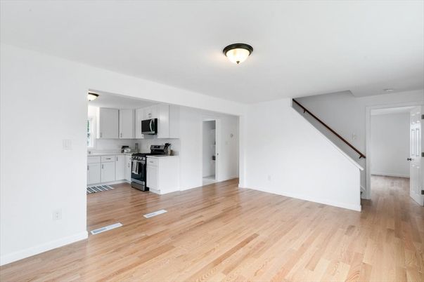 Empty room, Interior, Kitchen, Stainless Steel Appliances, Wood Texture Flooring