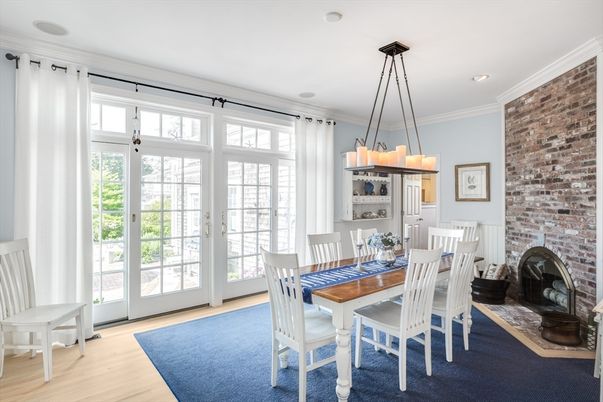 Chandelier, Dining room, Fireplace, Interior, Recessed Lighting, Stone Walls, Wood Texture Flooring