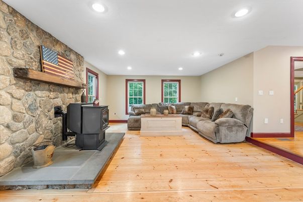 Fireplace, Interior, Living room, Recessed Lighting, Stone Walls, Wood Texture Flooring