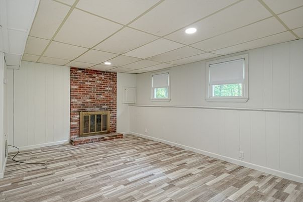 Empty room, Fireplace, Interior, Recessed Lighting, Stone Walls, Wood Texture Flooring