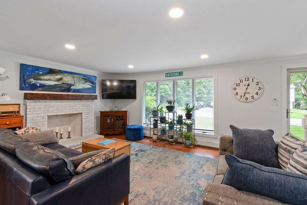 Fireplace, Interior, Living room, Recessed Lighting, Stone Walls, Wood Texture Flooring