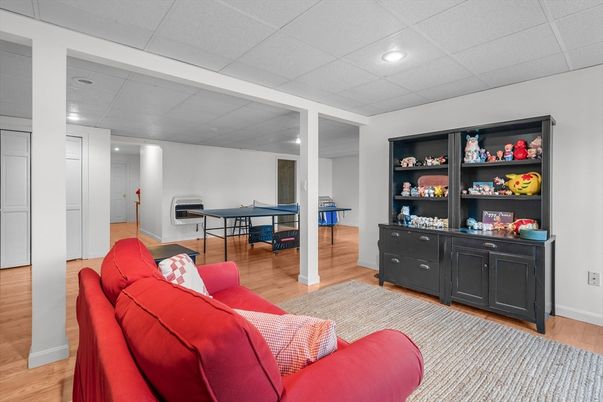 Fireplace, Game Room, Interior, Recessed Lighting, Wood Texture Flooring