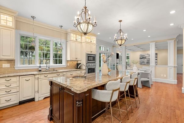 Chandelier, Dining room, Interior, Kitchen, Pendant Lights, Recessed Lighting, Stainless Steel Appliances, Wood Texture Flooring