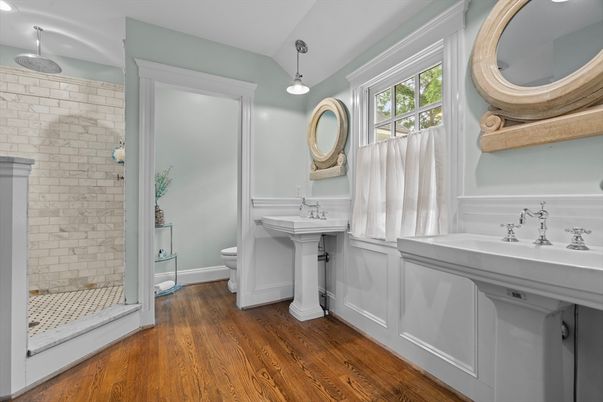 Bathroom, Dual Sink Vanities, Interior, Pendant Lights, Stone Walls, Wood Texture Flooring