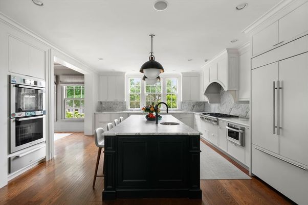 Interior, Kitchen, Marble Walls, Pendant Lights, Recessed Lighting, Stainless Steel Appliances, Wood Texture Flooring