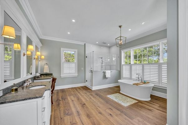 Bathroom, Dual Sink Vanities, Free Standing Baths, Glass Shower, Interior, Pendant Lights, Recessed Lighting, Wood Texture Flooring