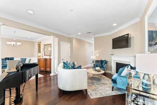 Chandelier, Fireplace, Interior, Living room, Piano, Recessed Lighting, Wood Texture Flooring