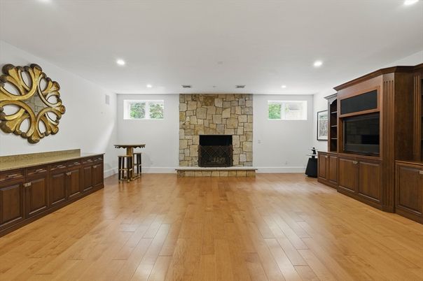 Empty room, Fireplace, Interior, Recessed Lighting, Stone Walls, Wood Texture Flooring