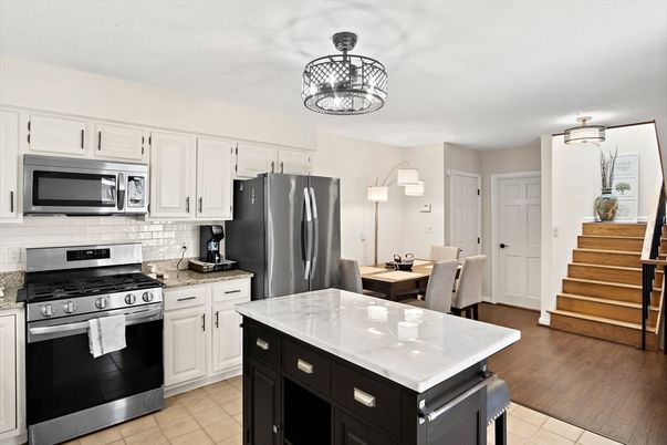 Chandelier, Dining room, Interior, Kitchen, Stainless Steel Appliances, Wood Texture Flooring