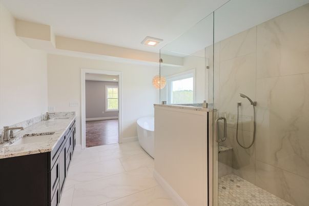 Bathroom, Chandelier, Dual Sink Vanities, Free Standing Baths, Glass Shower, Interior, Marble, Marble Walls, Recessed Lighting