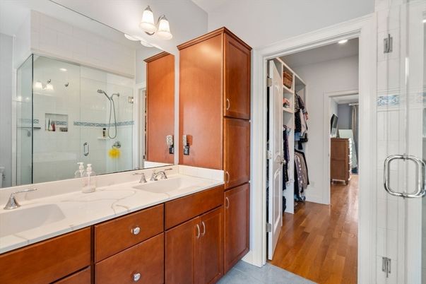Bathroom, Dual Sink Vanities, Glass Shower, Interior, Recessed Lighting, Wood Texture Flooring