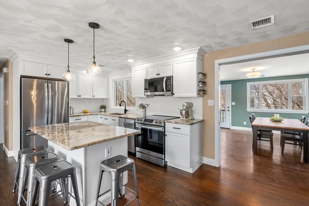 Dining room, Interior, Kitchen, Pendant Lights, Recessed Lighting, Stainless Steel Appliances, Wood Texture Flooring