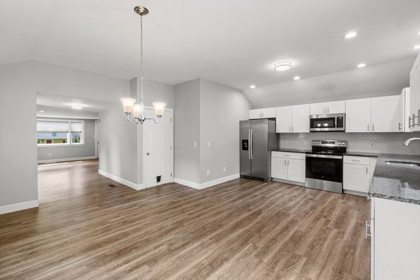 Chandelier, Interior, Kitchen, Pendant Lights, Recessed Lighting, Stainless Steel Appliances, Wood Texture Flooring