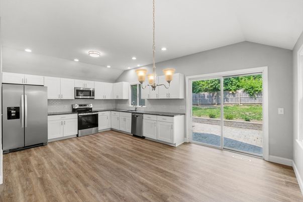 Interior, Kitchen, Pendant Lights, Recessed Lighting, Stainless Steel Appliances, Wood Texture Flooring