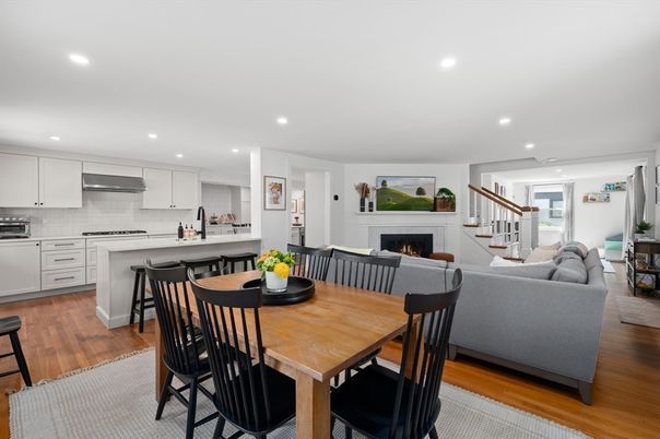 Dining room, Fireplace, Interior, Kitchen, Living room, Recessed Lighting, Stainless Steel Appliances, Wood Texture Flooring