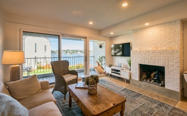 Fireplace, Interior, Living room, Recessed Lighting, Stone Walls, Water, Wood Texture Flooring