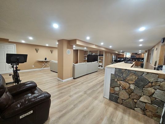 Fitness Equipment, Interior, Kitchen, Living room, Recessed Lighting, Stone Walls, Wood Texture Flooring