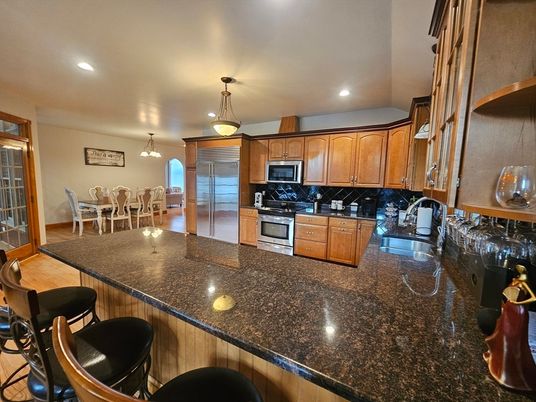 Dining room, Interior, Kitchen, Pendant Lights, Recessed Lighting, Stainless Steel Appliances, Wood Texture Flooring