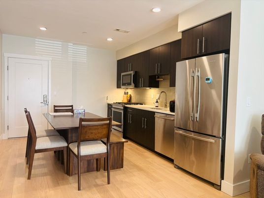 Dining room, Interior, Kitchen, Recessed Lighting, Stainless Steel Appliances, Wood Texture Flooring