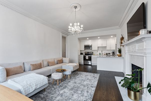 Chandelier, Fireplace, Interior, Kitchen, Living room, Pendant Lights, Recessed Lighting, Stainless Steel Appliances, Wood Texture Flooring