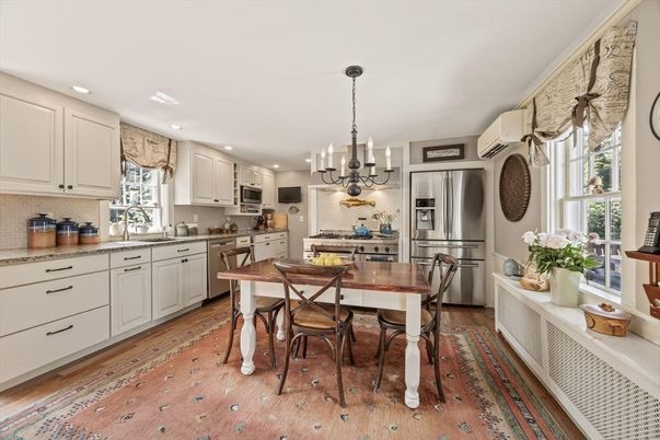 Chandelier, Dining room, Interior, Kitchen, Pendant Lights, Recessed Lighting, Stainless Steel Appliances, Wood Texture Flooring