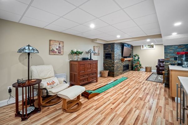 Fireplace, Interior, Recessed Lighting, Stone Walls, Wood Texture Flooring