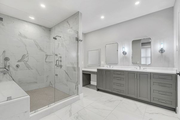 Bathroom, Dual Sink Vanities, Glass Shower, Interior, Marble, Marble Walls, Recessed Lighting