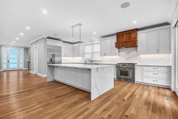 Interior, Kitchen, Marble Walls, Pendant Lights, Recessed Lighting, Stainless Steel Appliances, Wood Texture Flooring