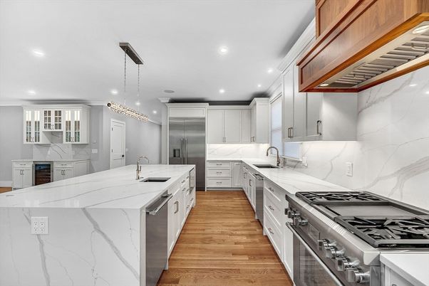 Interior, Kitchen, Marble Walls, Pendant Lights, Recessed Lighting, Stainless Steel Appliances, Wood Texture Flooring