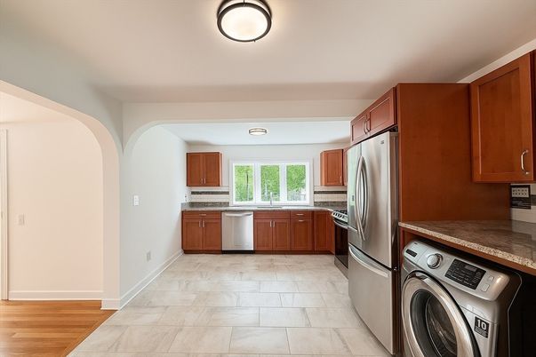 Interior, Kitchen, Recessed Lighting, Washer, Wood Texture Flooring