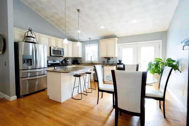 Dining room, Interior, Kitchen, Pendant Lights, Recessed Lighting, Stainless Steel Appliances, Wood Texture Flooring