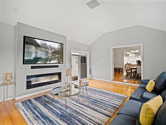 Chandelier, Dining room, Fireplace, Interior, Living room, Recessed Lighting, Wood Texture Flooring