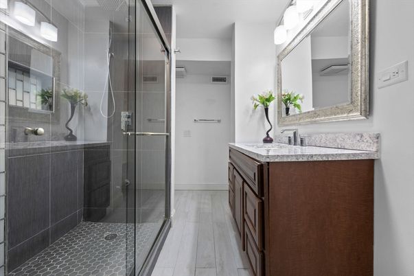 Bathroom, Dual Sink Vanities, Glass Shower, Interior, Wood Texture Flooring