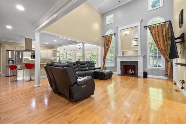 Chandelier, Fireplace, Interior, Kitchen, Living room, Recessed Lighting, Stainless Steel Appliances, Wood Texture Flooring