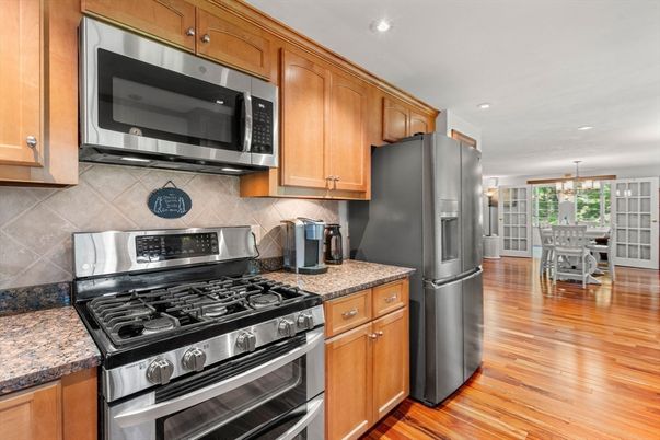 Chandelier, Dining room, Interior, Kitchen, Pendant Lights, Recessed Lighting, Stainless Steel Appliances, Wood Texture Flooring