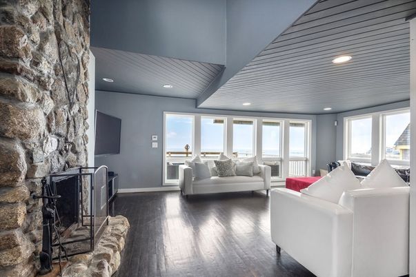 Fireplace, Interior, Living room, Recessed Lighting, Stone Walls, Water, Wood Texture Flooring