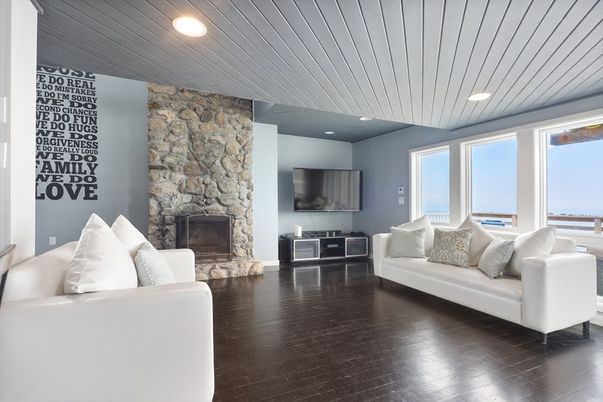 Fireplace, Interior, Living room, Recessed Lighting, Stone Walls, Wood Texture Flooring
