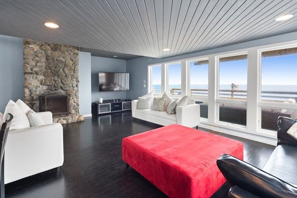 Fireplace, Interior, Living room, Recessed Lighting, Stone Walls, Water, Wood Texture Flooring
