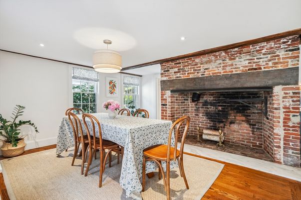 Dining room, Fireplace, Interior, Recessed Lighting, Stone Walls, Wood Texture Flooring