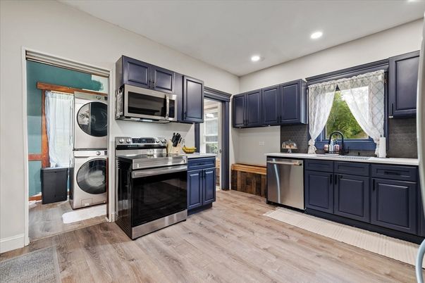 Interior, Kitchen, Recessed Lighting, Stainless Steel Appliances, Washer, Wood Texture Flooring