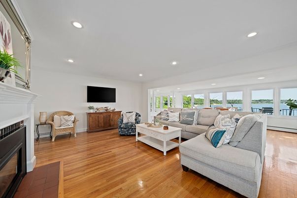 Fireplace, Interior, Living room, Recessed Lighting, Water, Wood Texture Flooring